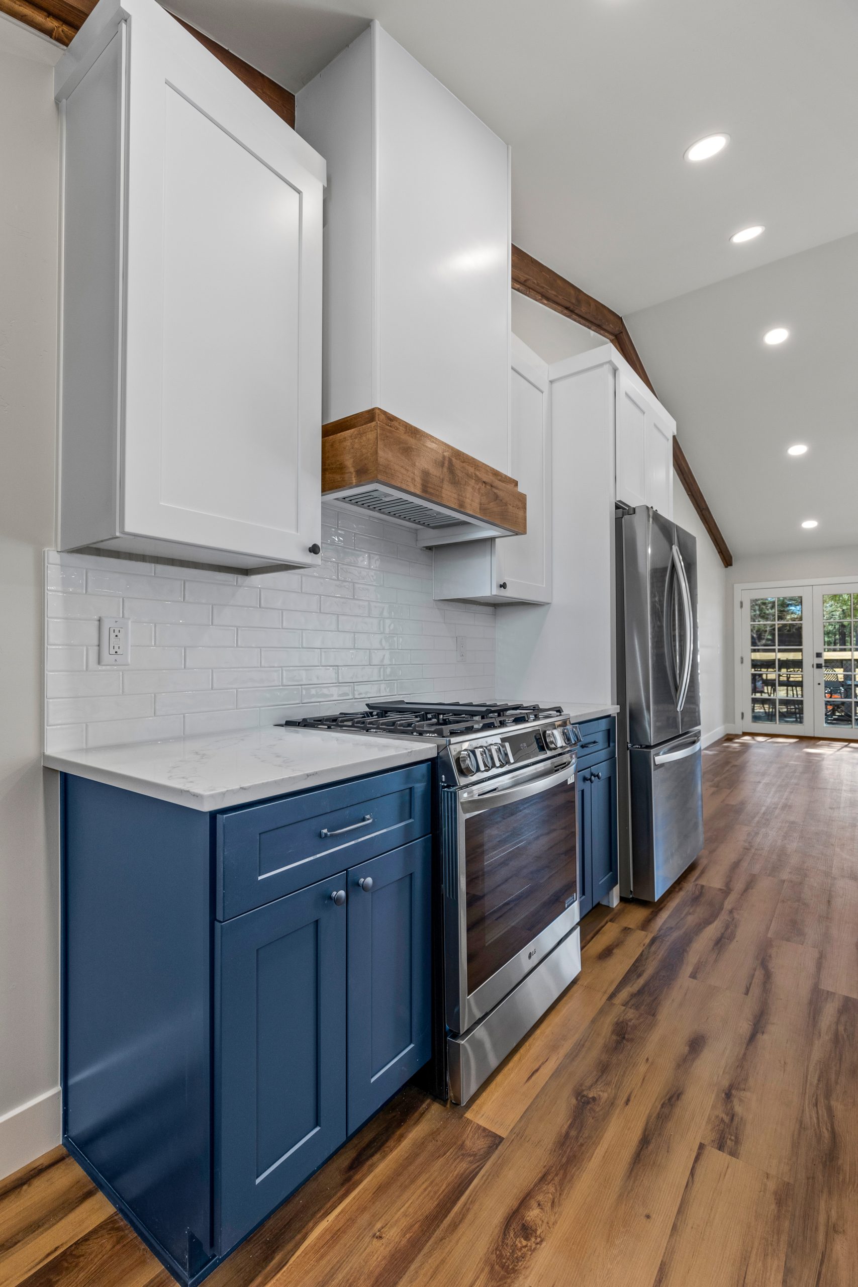 remodeled kitchen with blue and white cabinetry